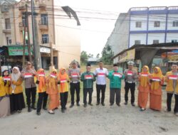 Polres Sergai Sambut HUT Rl Ke-80 Bersama Organisasi Kemasyarakatan Bagikan Bendera Merah Putih